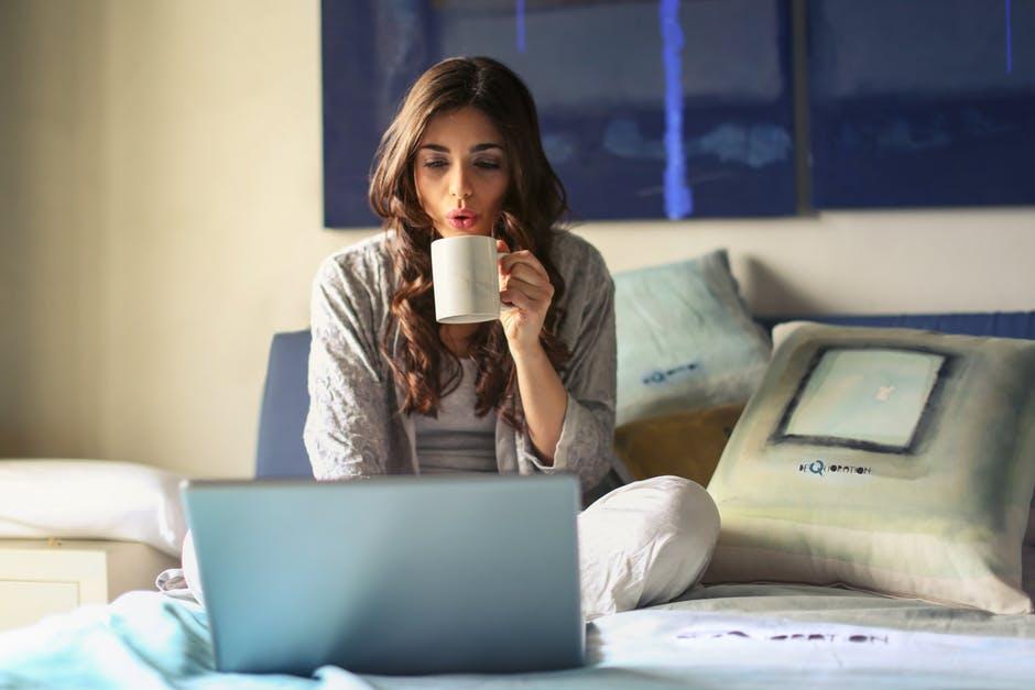 Woman Working From Home With a Coffee