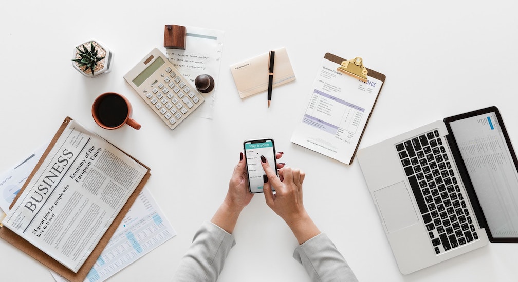 Woman Managing Finances With Phone